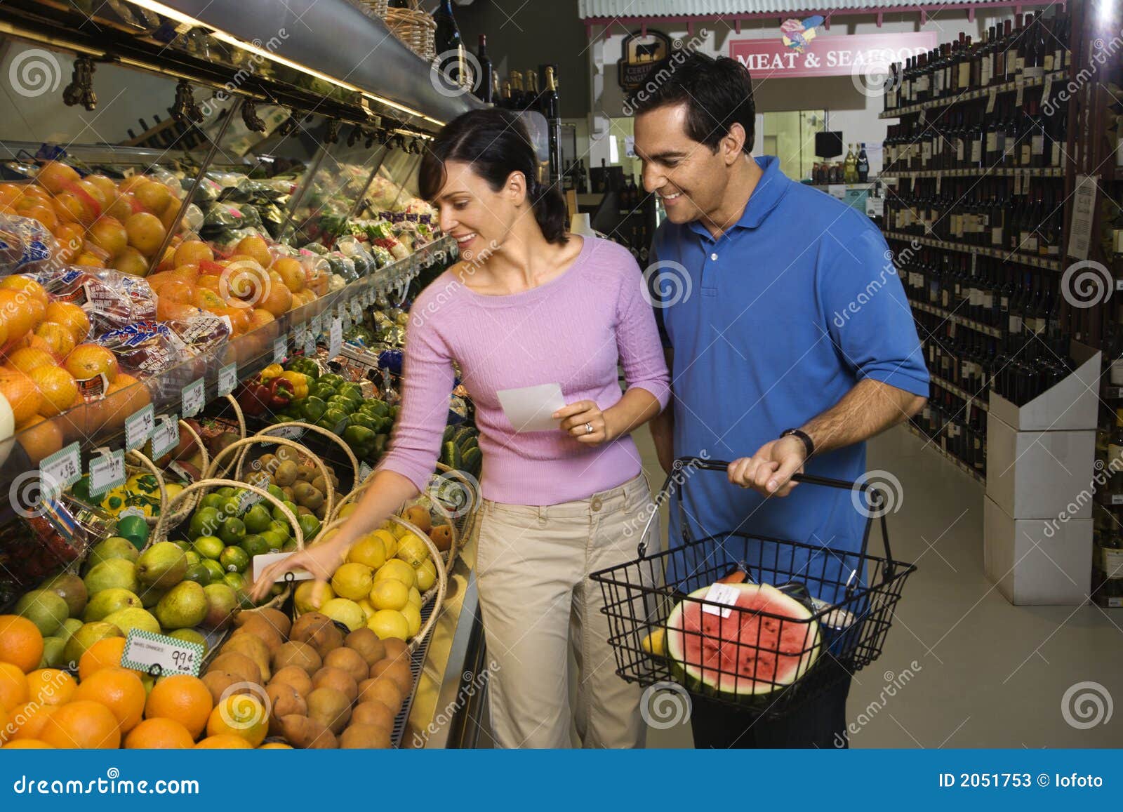 Couple grocery shopping. stock image. Image of indoors 2051753