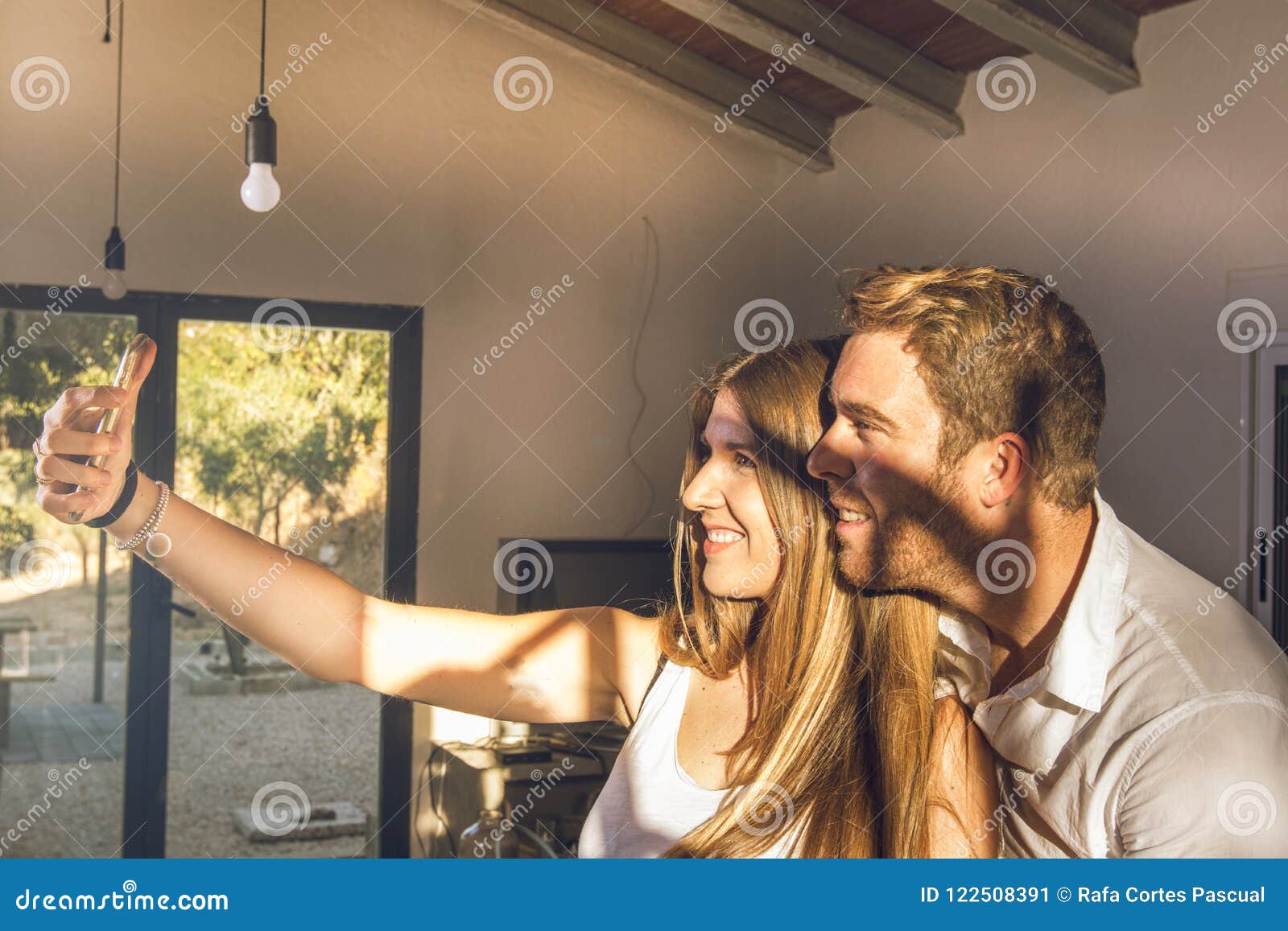 Couple Of Guy And Girl Making A Selfie At Home G