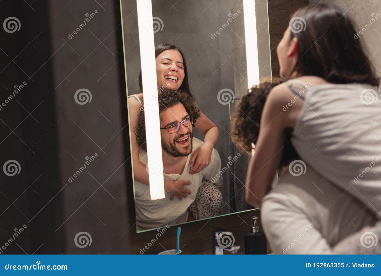 Couple Having Fun In Front Of Bathroom Mirror Stock Image Ima