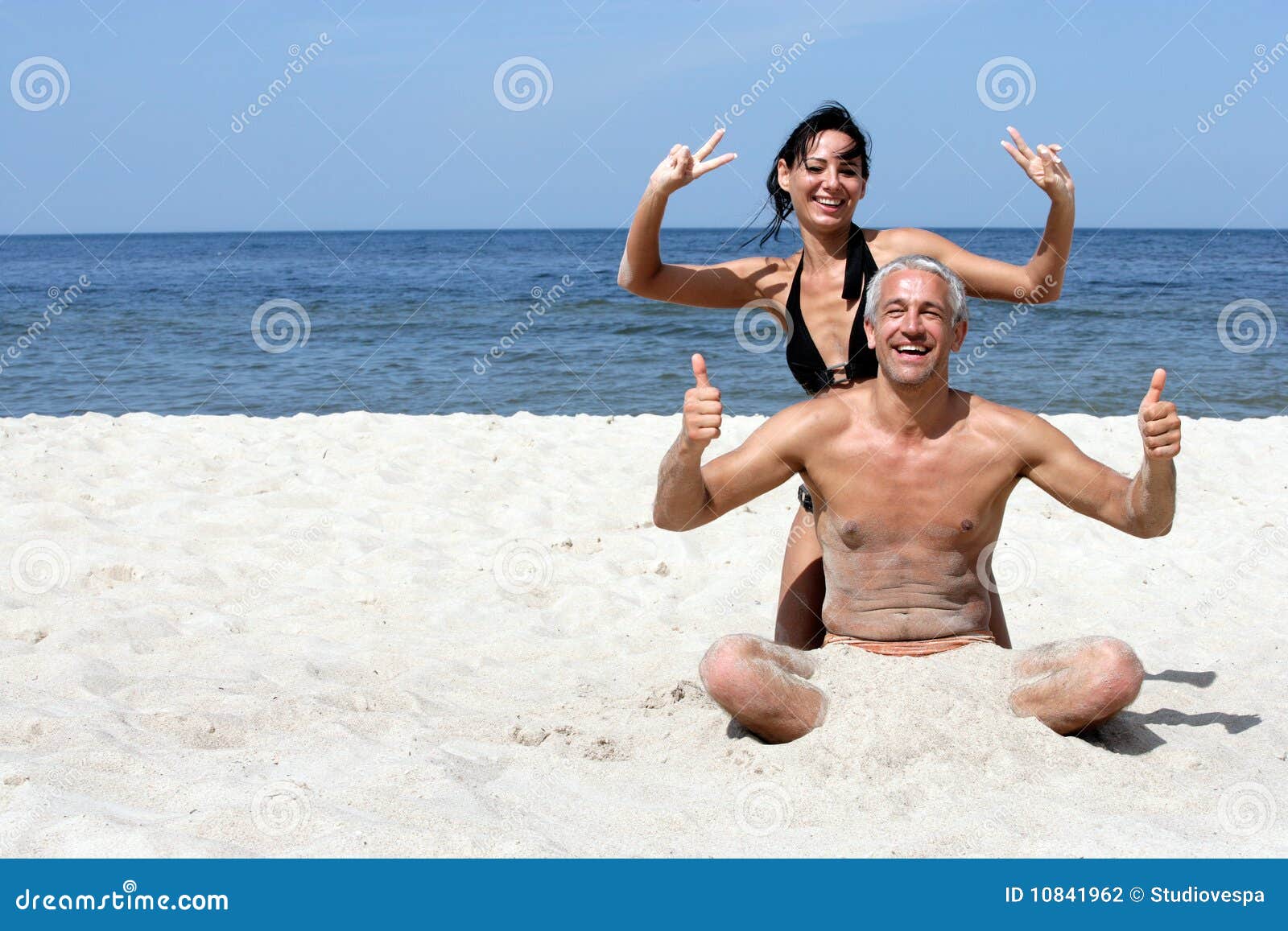 couple having fun indicating ok signs