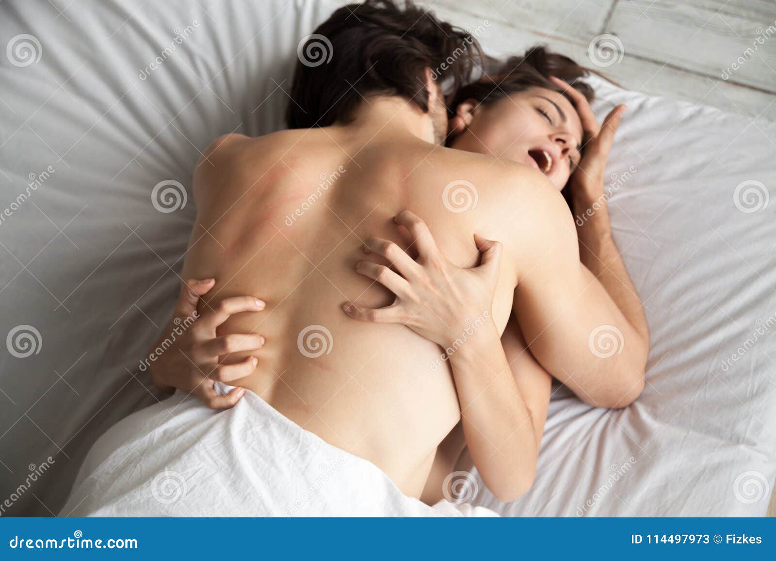 Couple Having Passionate Sex, Woman Moaning in Ecstasy, Top View Stock Image picture picture