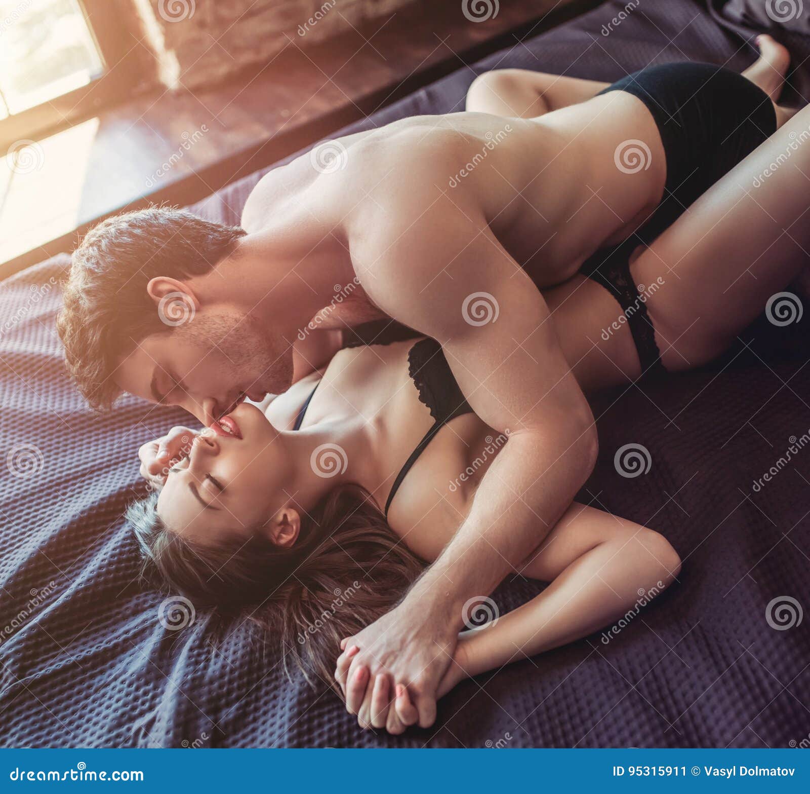 Couple Having Sex On Bed