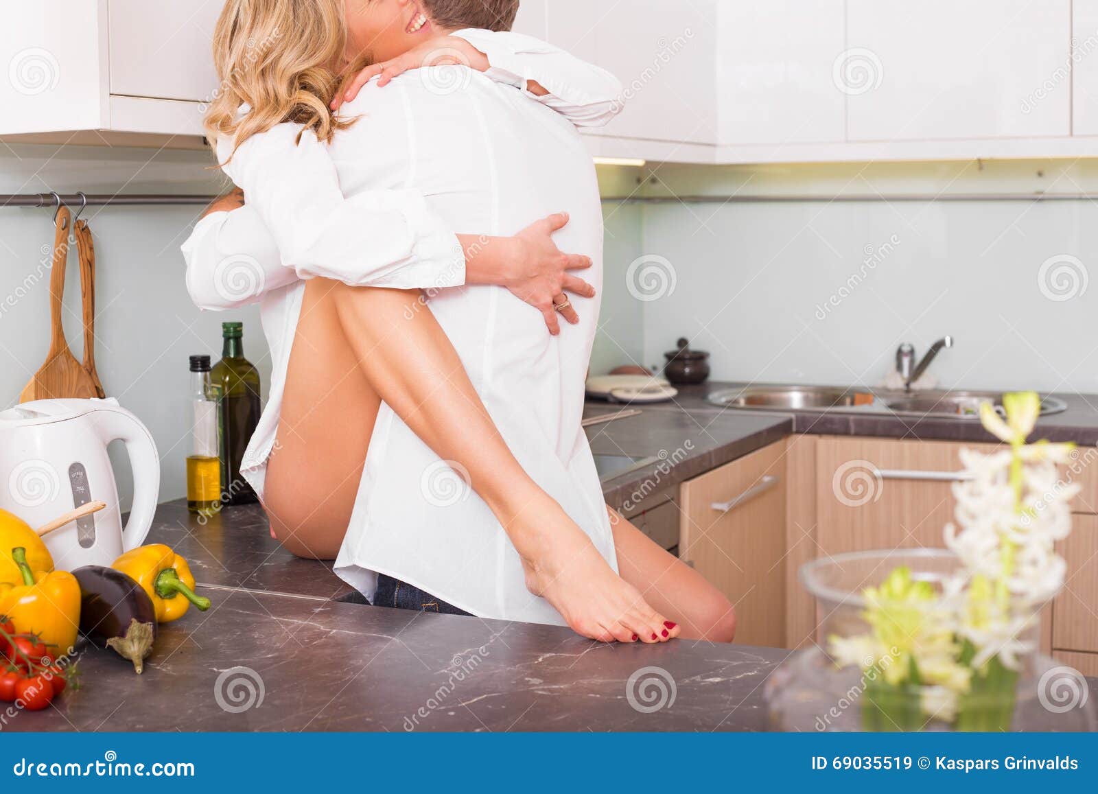 Couple Having Sex on Kitchen Counter Stock Image picture picture