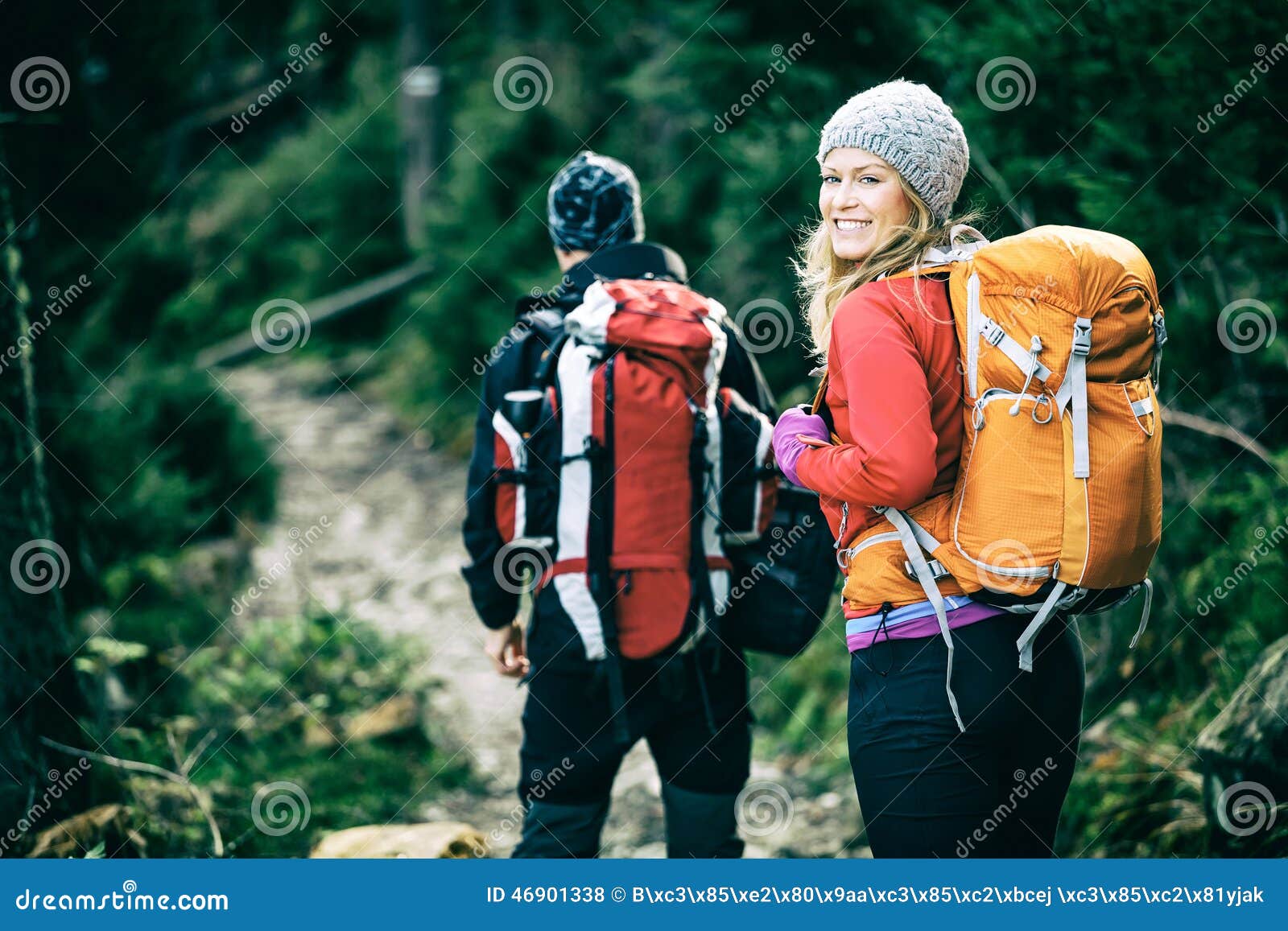 couple hikers walking in mountains
