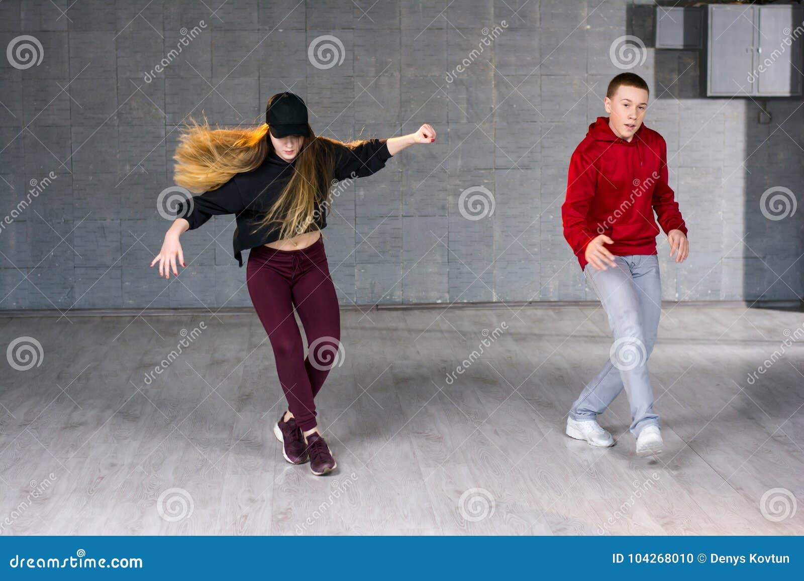 Couple Of Hip-hop Dancers Is Dancing. Stock Photo - Image of fashion