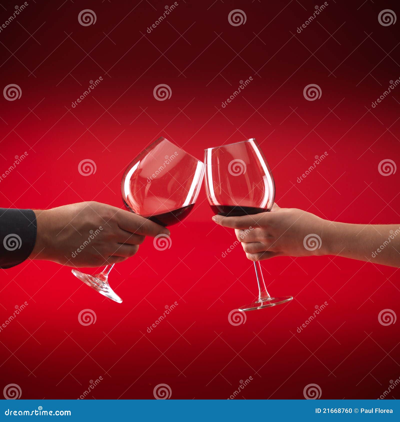 Couple Holding Glasses Of Red Wine Toasting Stock Photo Image of