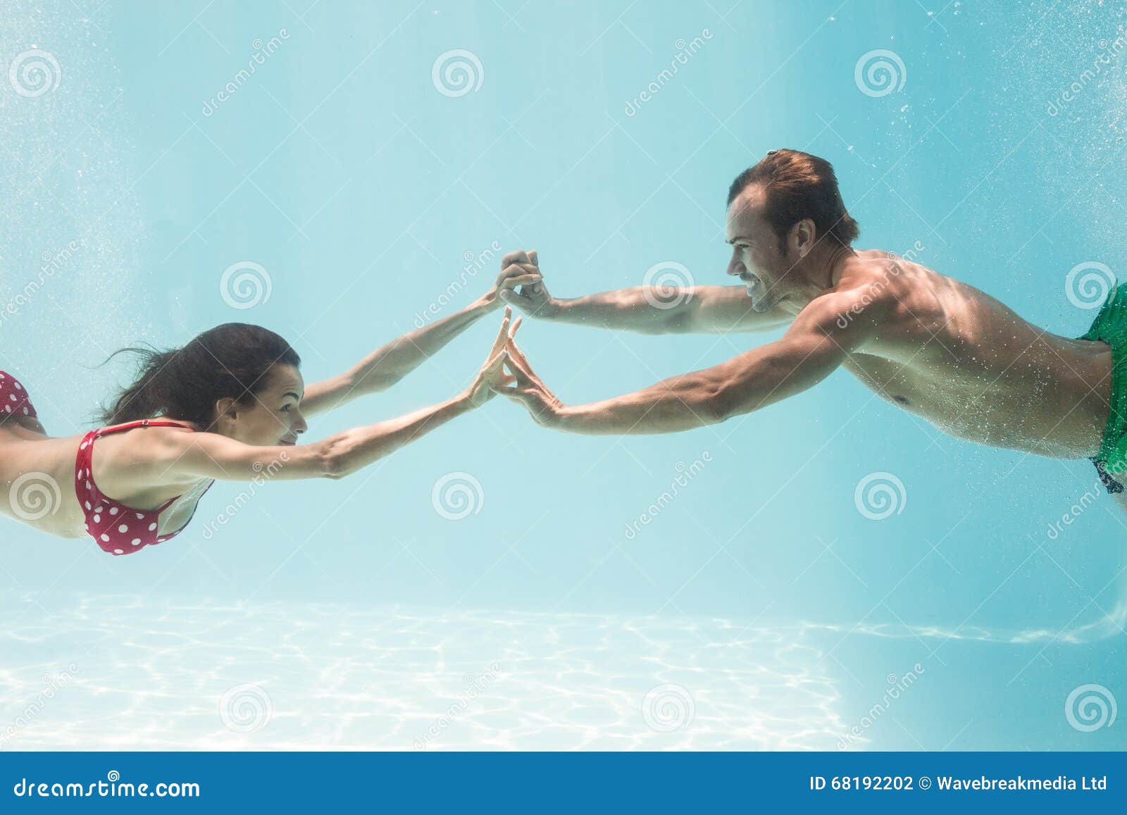 Couple Holding Hands while Swimming Underwater Stock Photo Image of