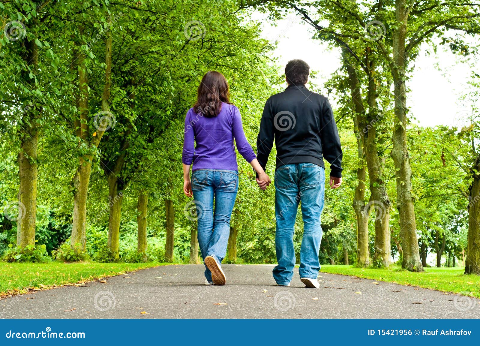 Couple Holding Hands and Walking in a Park Stock Photo Image of