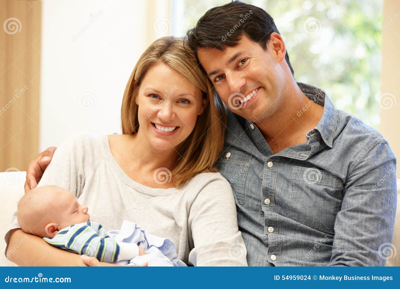 Couple at Home with New Baby Stock Photo Image of portrait, sitting