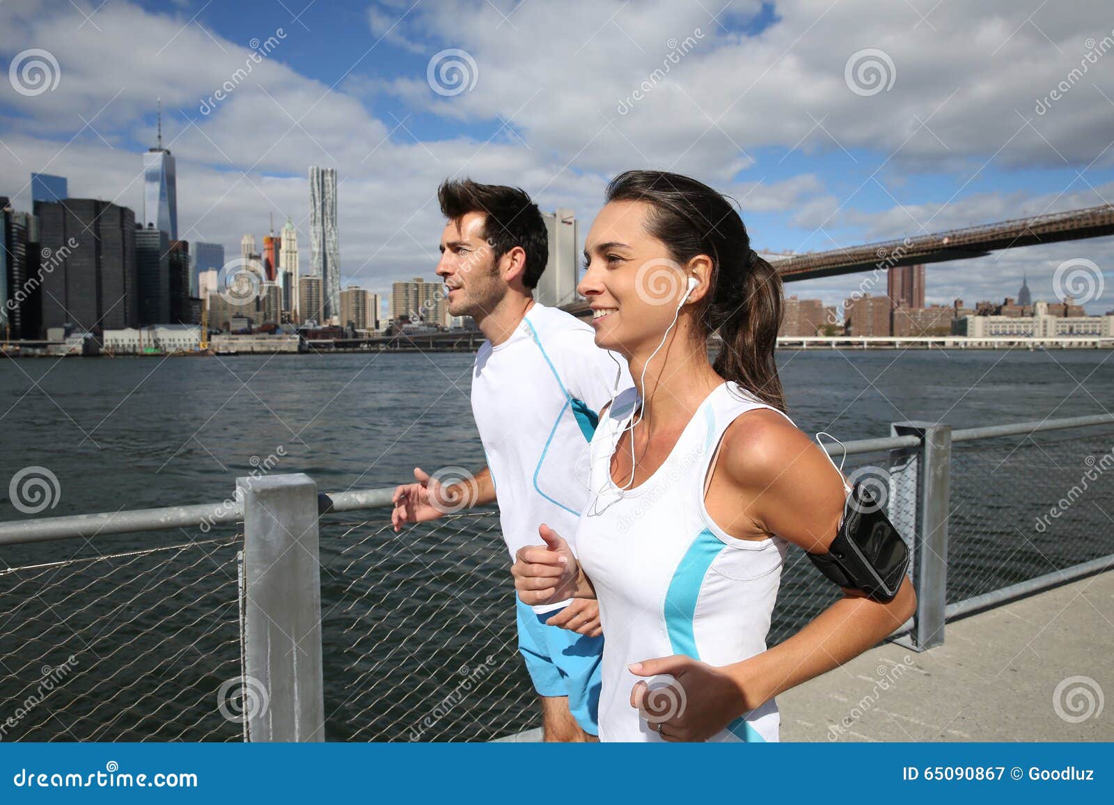 couple of joggers by hudson river