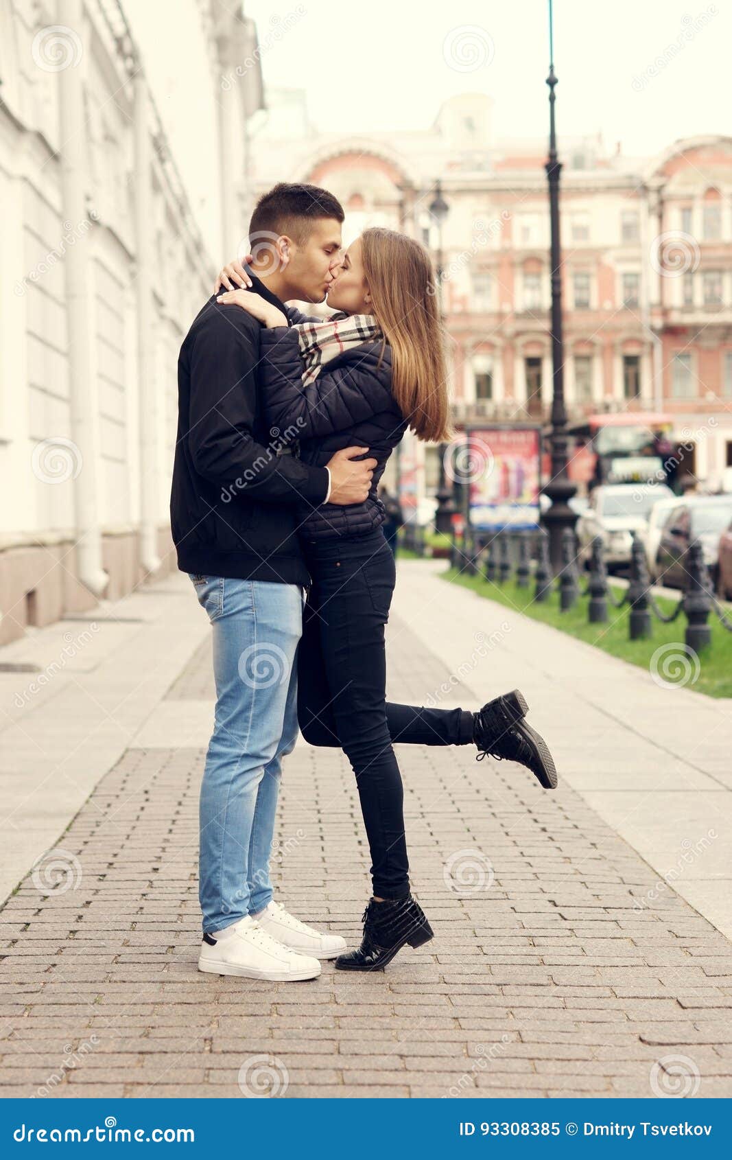 Couple kissing at street stock image. Image of outdoors - 93308385