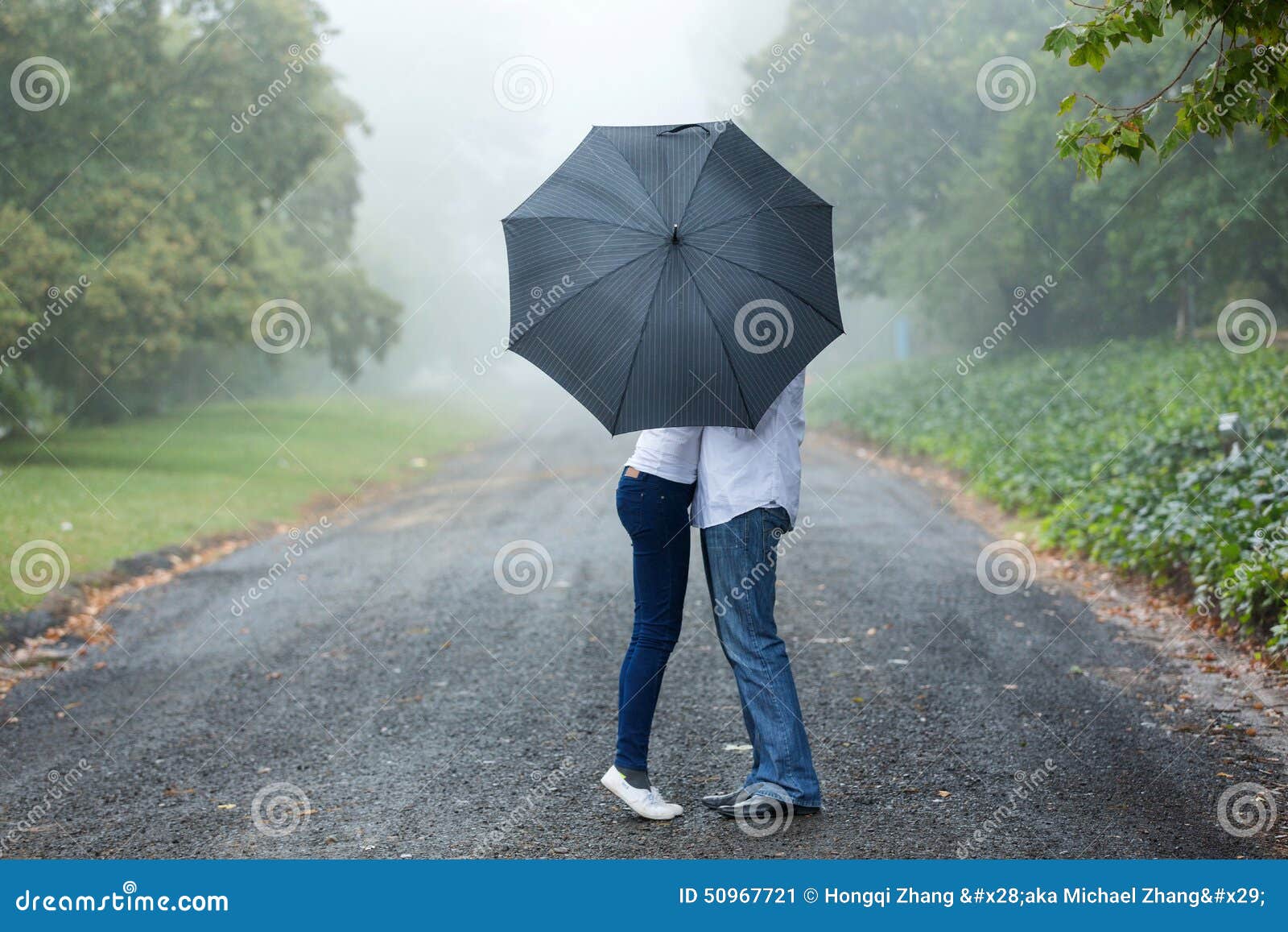 Couple kissing umbrella stock image. Image of attractive 50967721