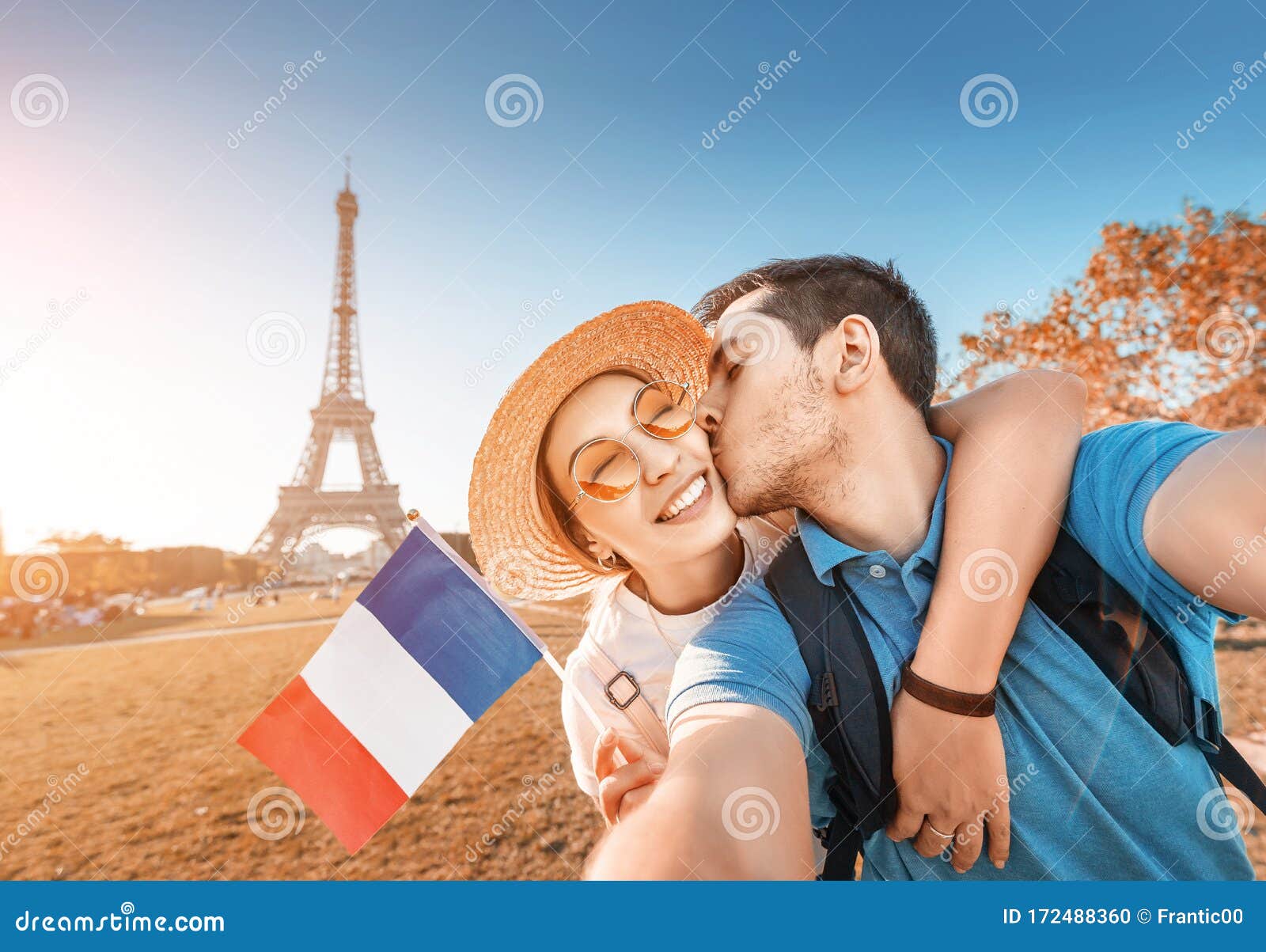 Couple in Love Hugging and Taking Selfie with French Flag and Eiffel Tower  in the Background. Honeymoon Travel in Stock Photo - Image of feeling,  hugging: 172488360