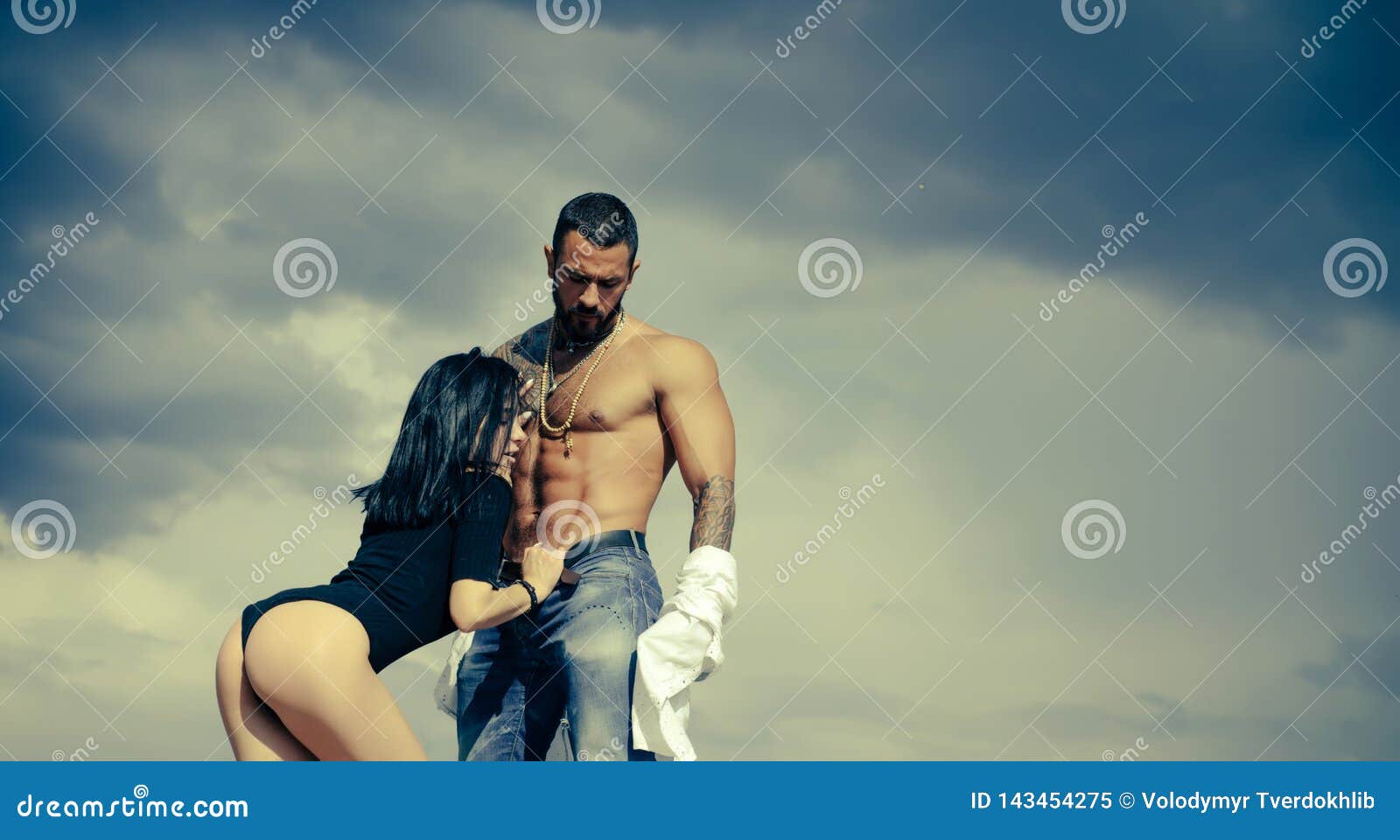 Couple in Love. Love and Flirt. Muscular Man and Fit Slim Young Female. Couple Goals photo