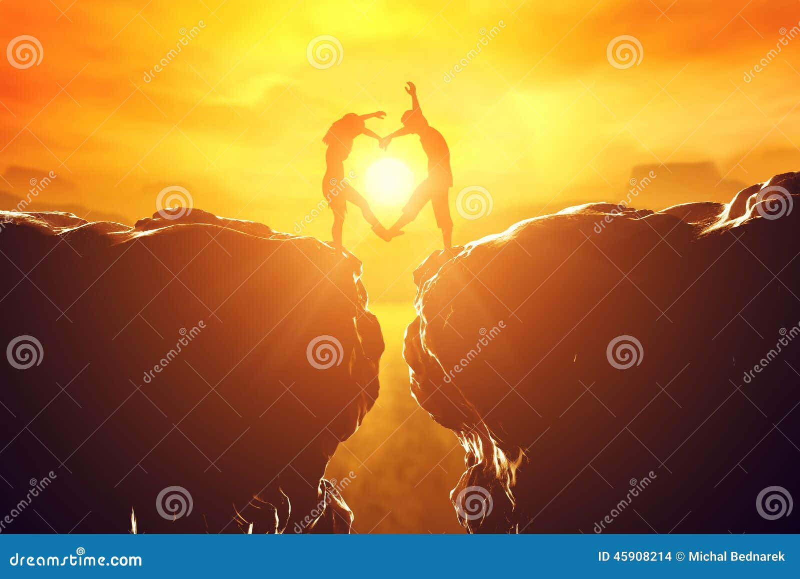 couple in love making heart  over precipice