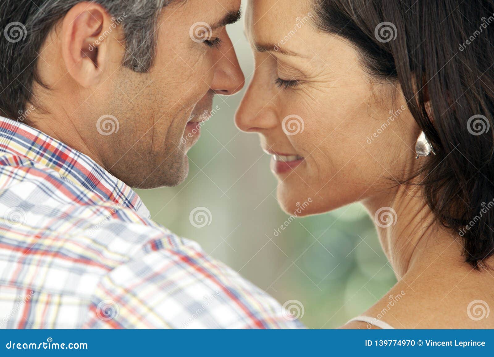 couple in love - moment of intimacy between middle aged man and woman
