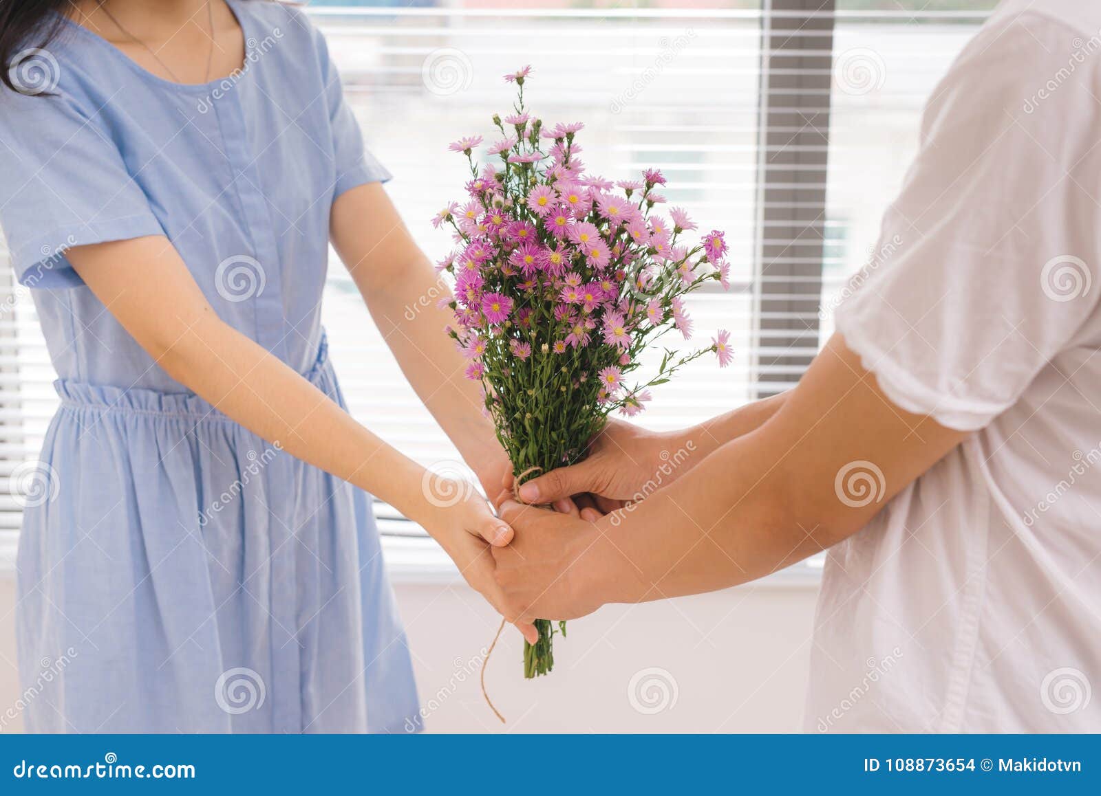 Couple in Love. Romantic Man Giving Flowers To His Girlfriend ...