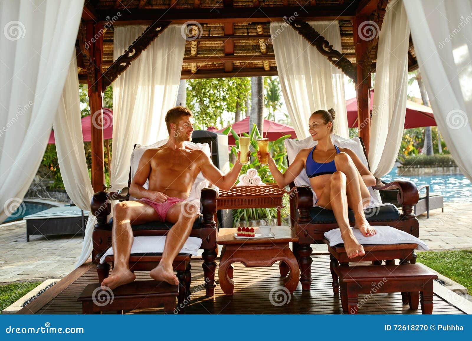 Couple in Love on Romantic Vacation with Cocktails at Spa Stock