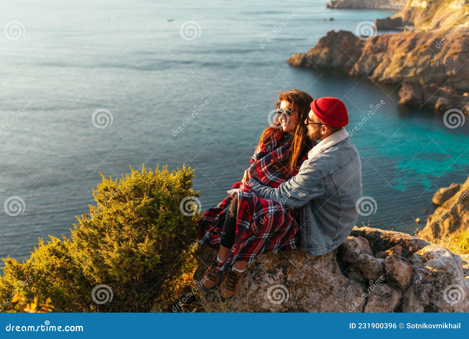 A Couple in Love at Sunset by the Sea. Wedding Trip. a Man and a Woman ...