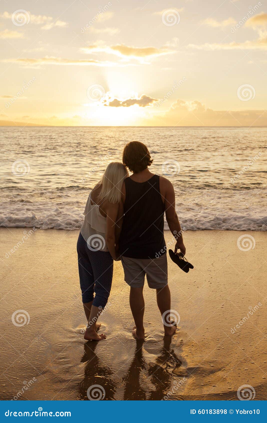 Couple in Love Watching a Sunset at the Beach Together Stock Photo ...