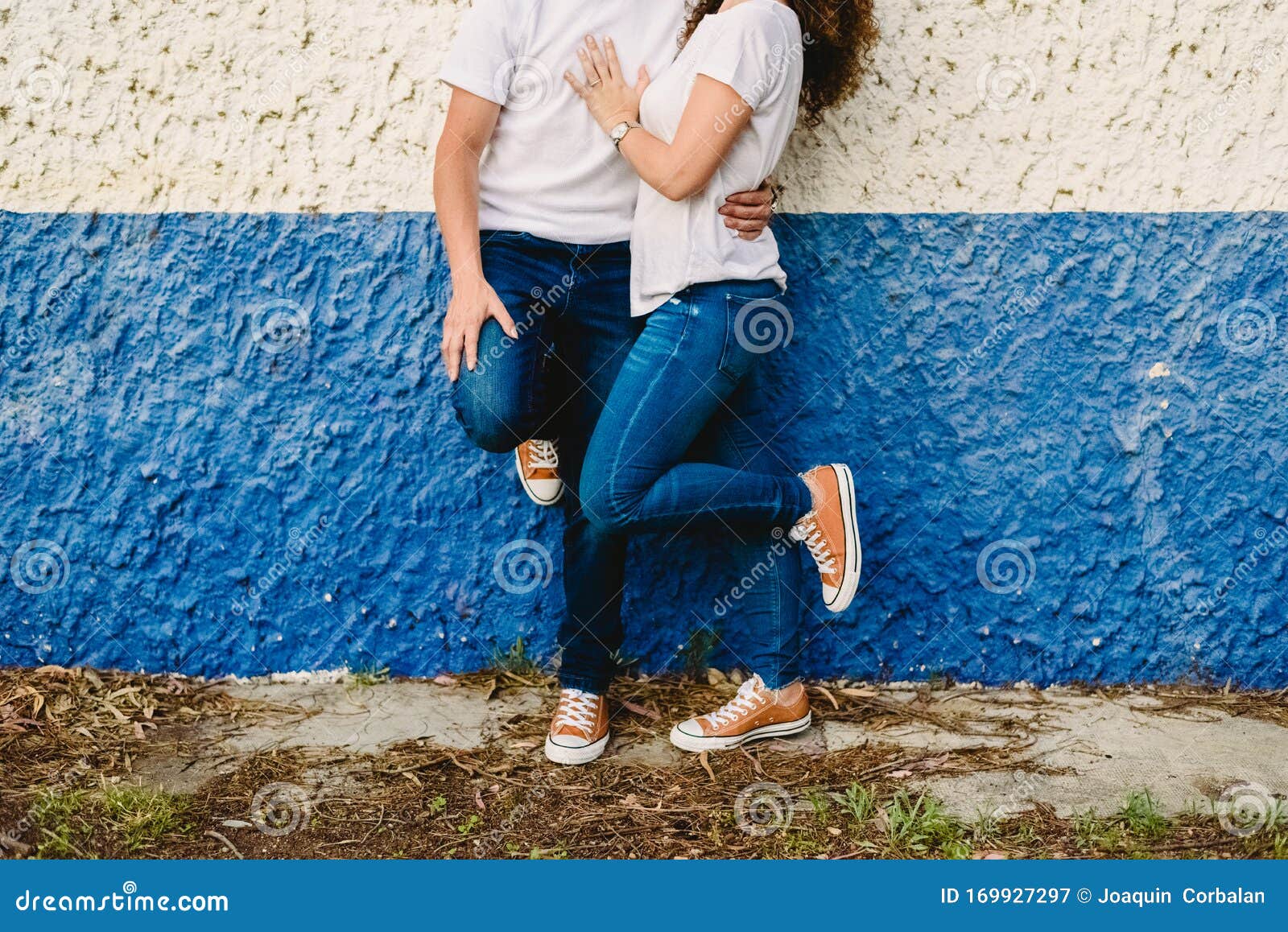 Couple of Lovers Resting on Blue and White Wall in Jeans Stock Image - Image of relationship, handsome: 169927297