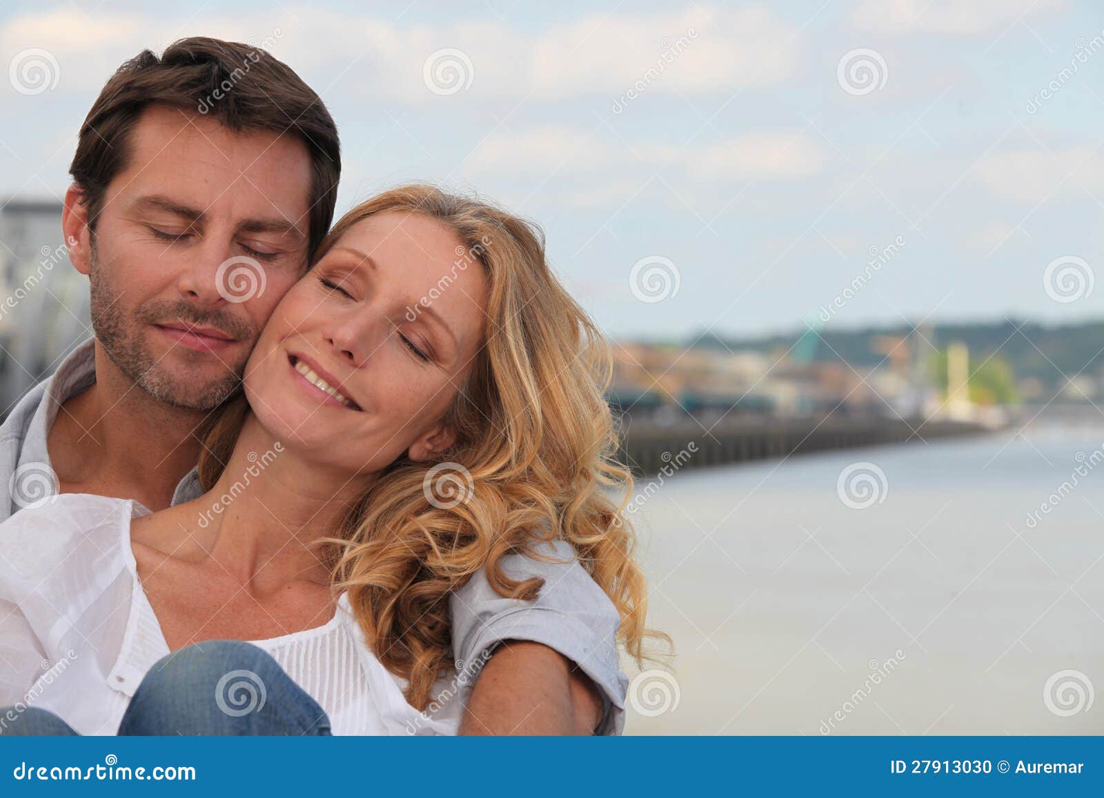 Couple in a loving embrace on the waterfront of Bordeaux