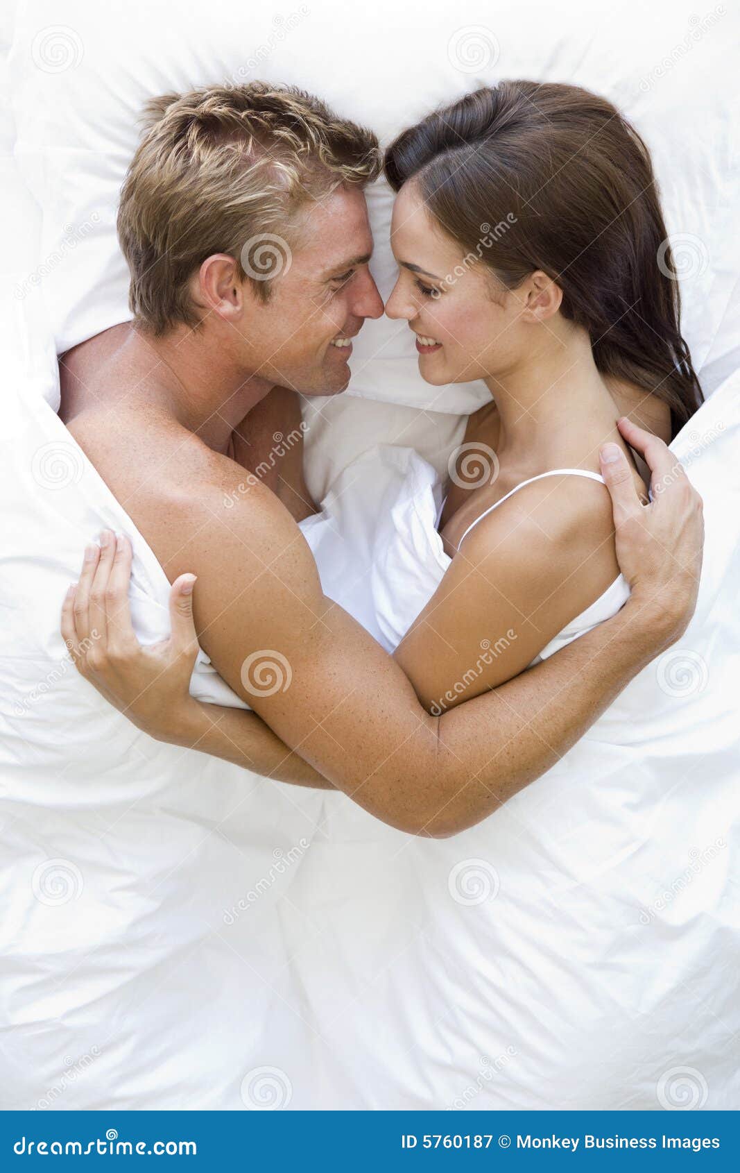 Couple Lying In Bed Smiling Stock Image Image Of Head Above 5760187