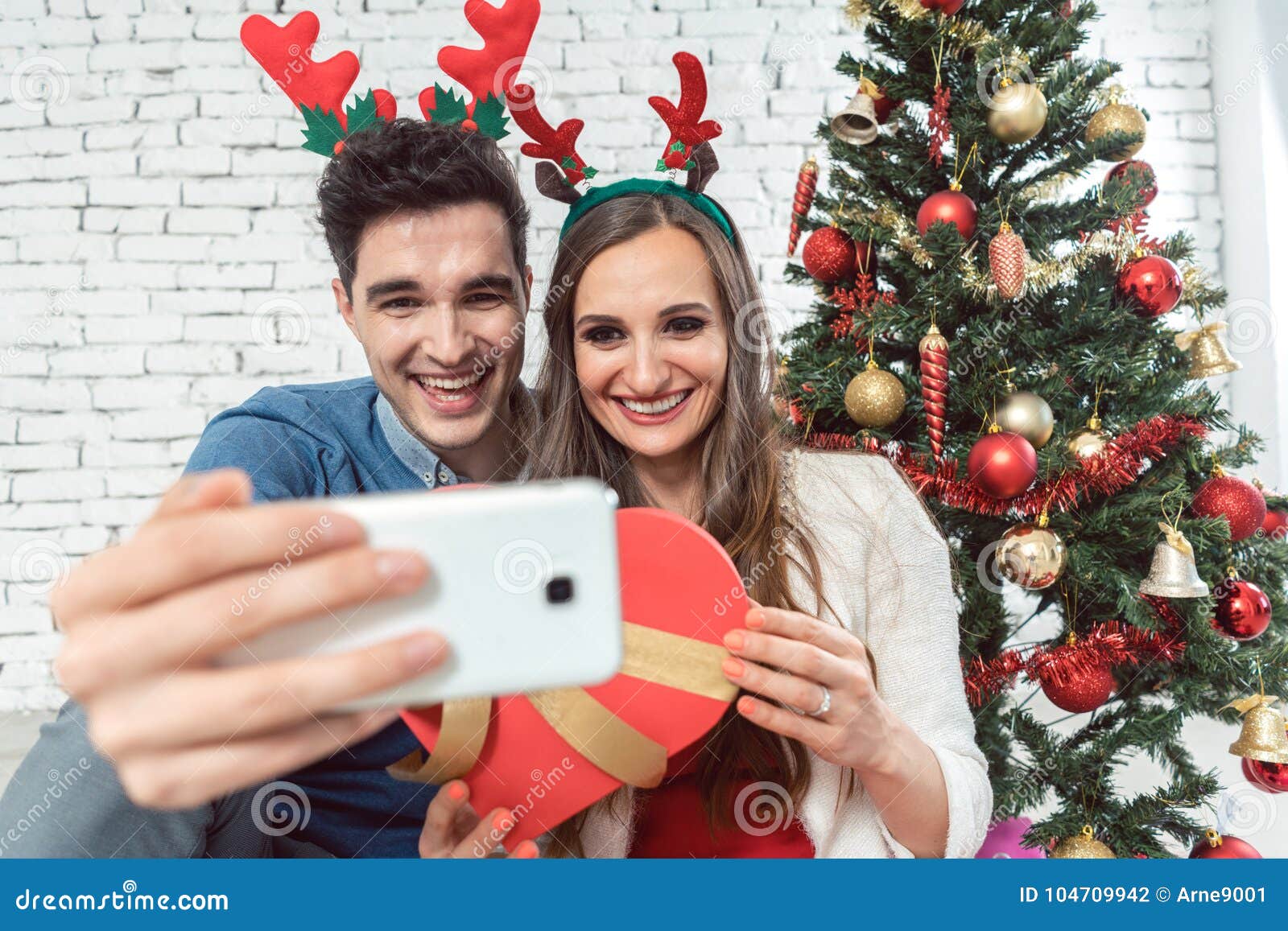 Couple Making Selfie Photos with Phone on Christmas Stock Photo - Image ...