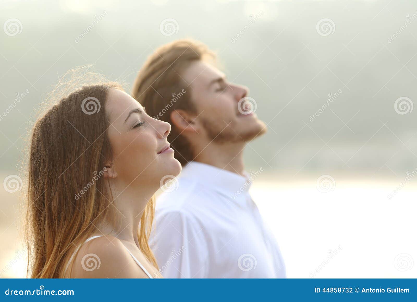 couple of man and woman breathing deep fresh air