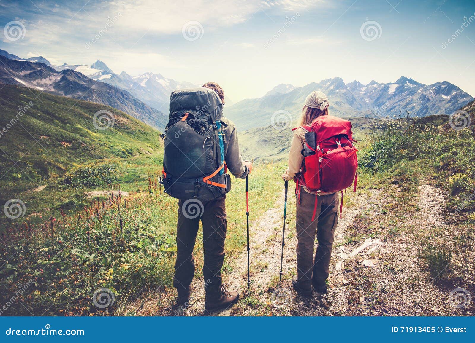 couple man and woman travelers backpackers mountaineering