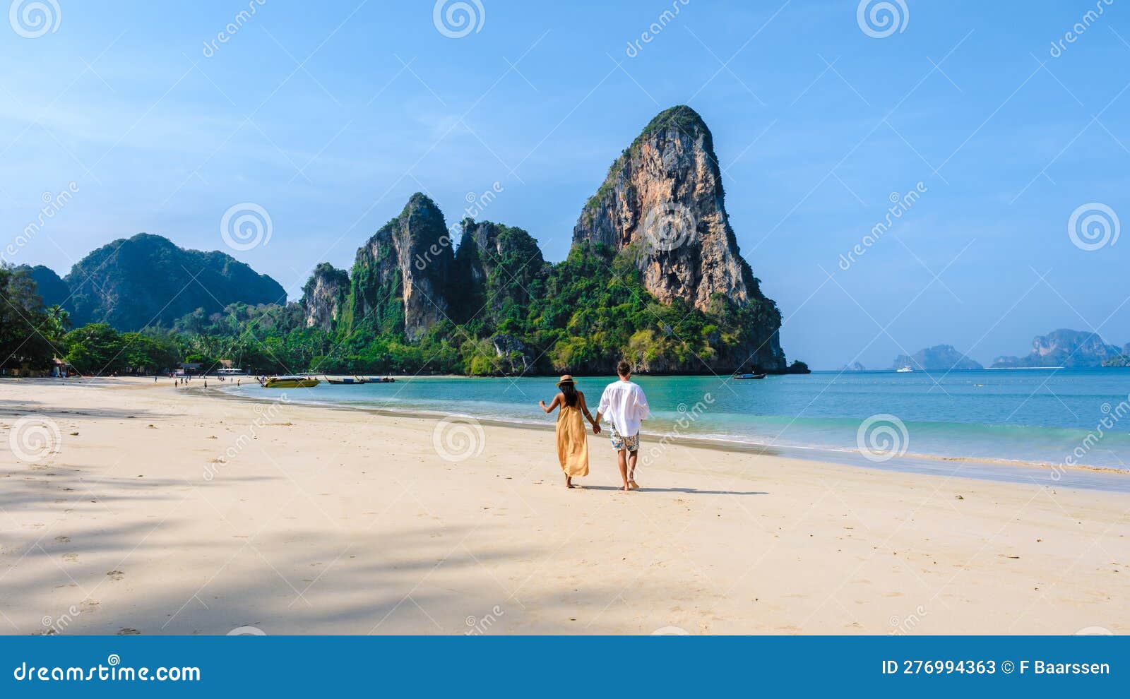 Railay Beach Krabi Thailand, a couple of men and woman on the