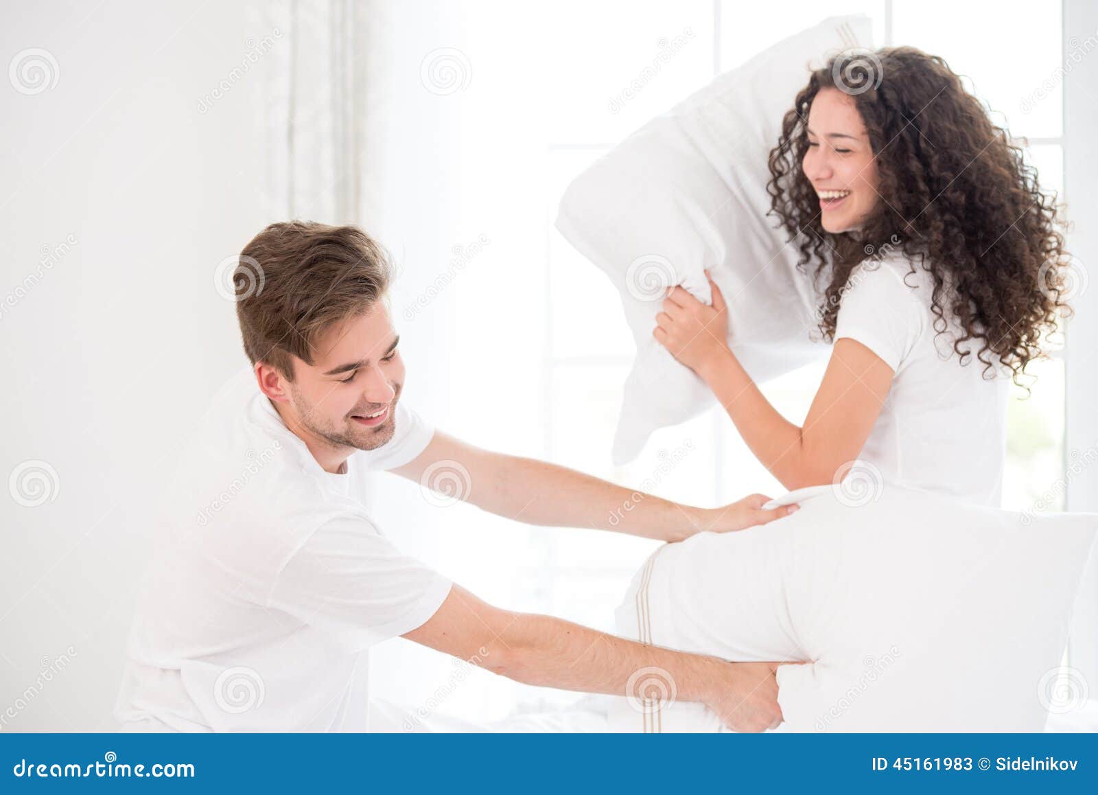 Couple pillow fighting stock image. Image of beauty, portrait 45161983