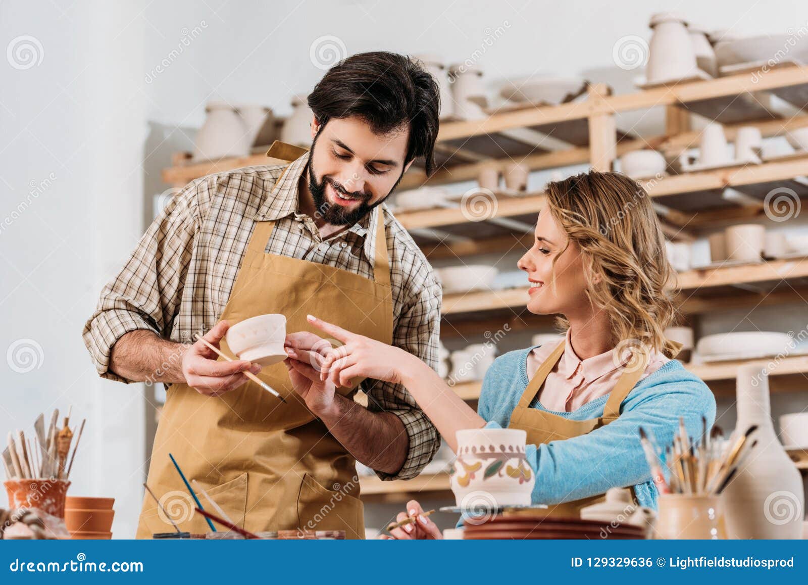 Couple of Potters Painting Ceramic Dishware Stock Photo Image of