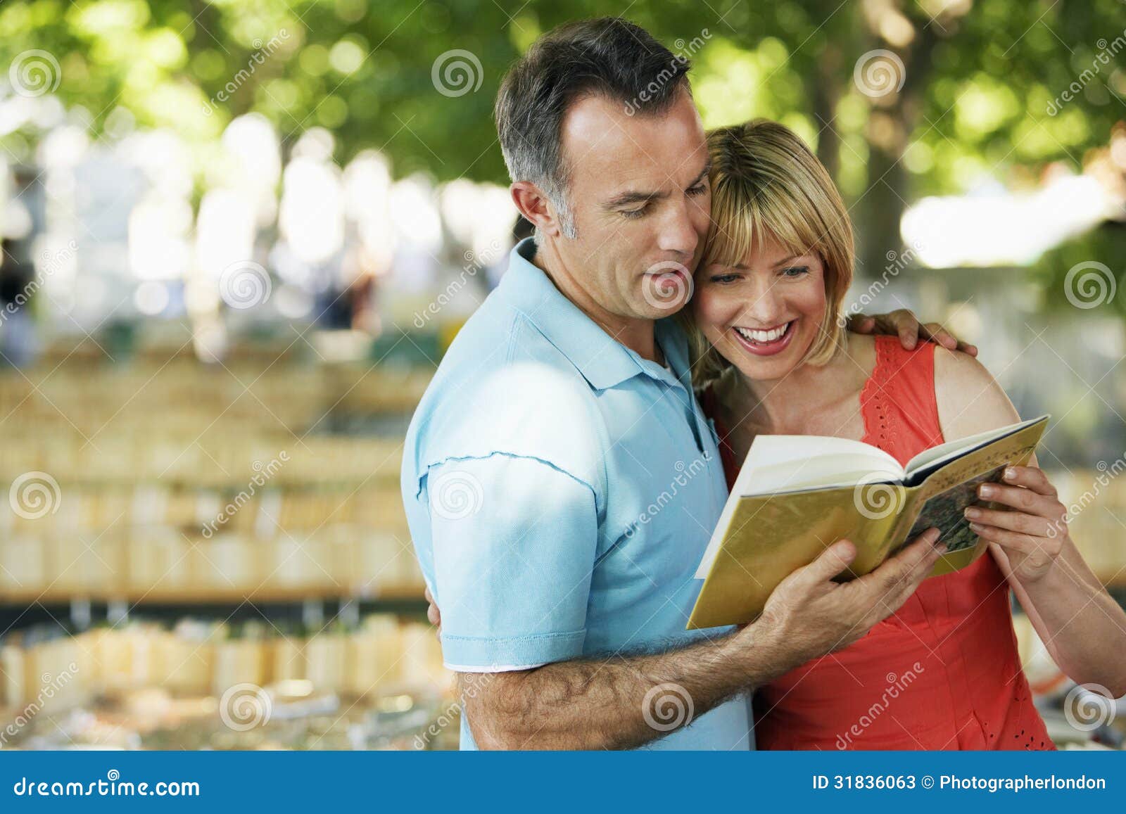 couple reading guidebook