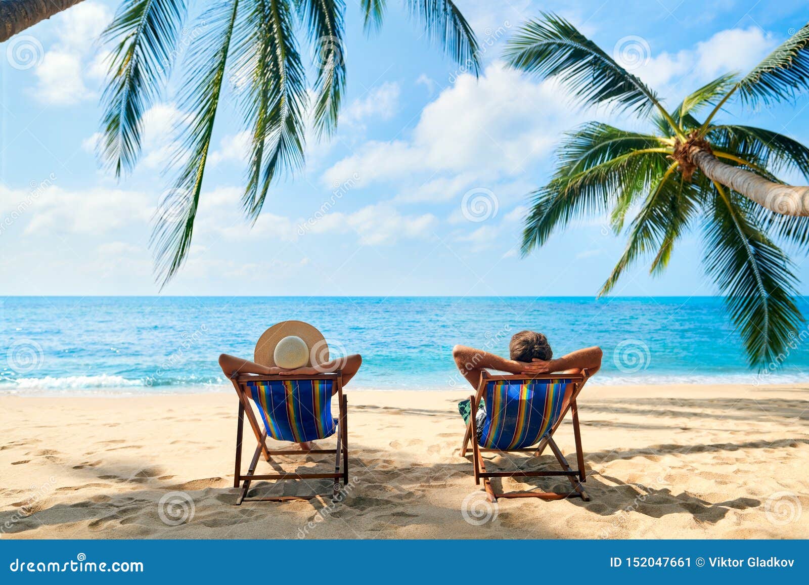 Couple Relax On The Beach Enjoy Beautiful Sea On The Tropical Island
