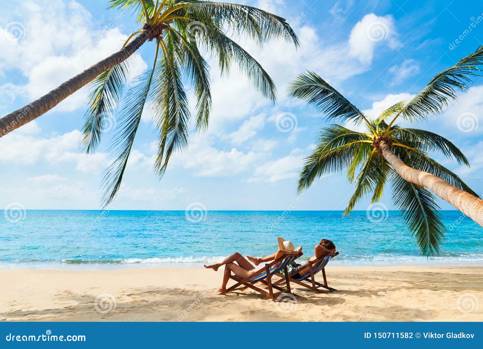 Couple Relax on the Beach Enjoying Beautiful Sea on the Tropical