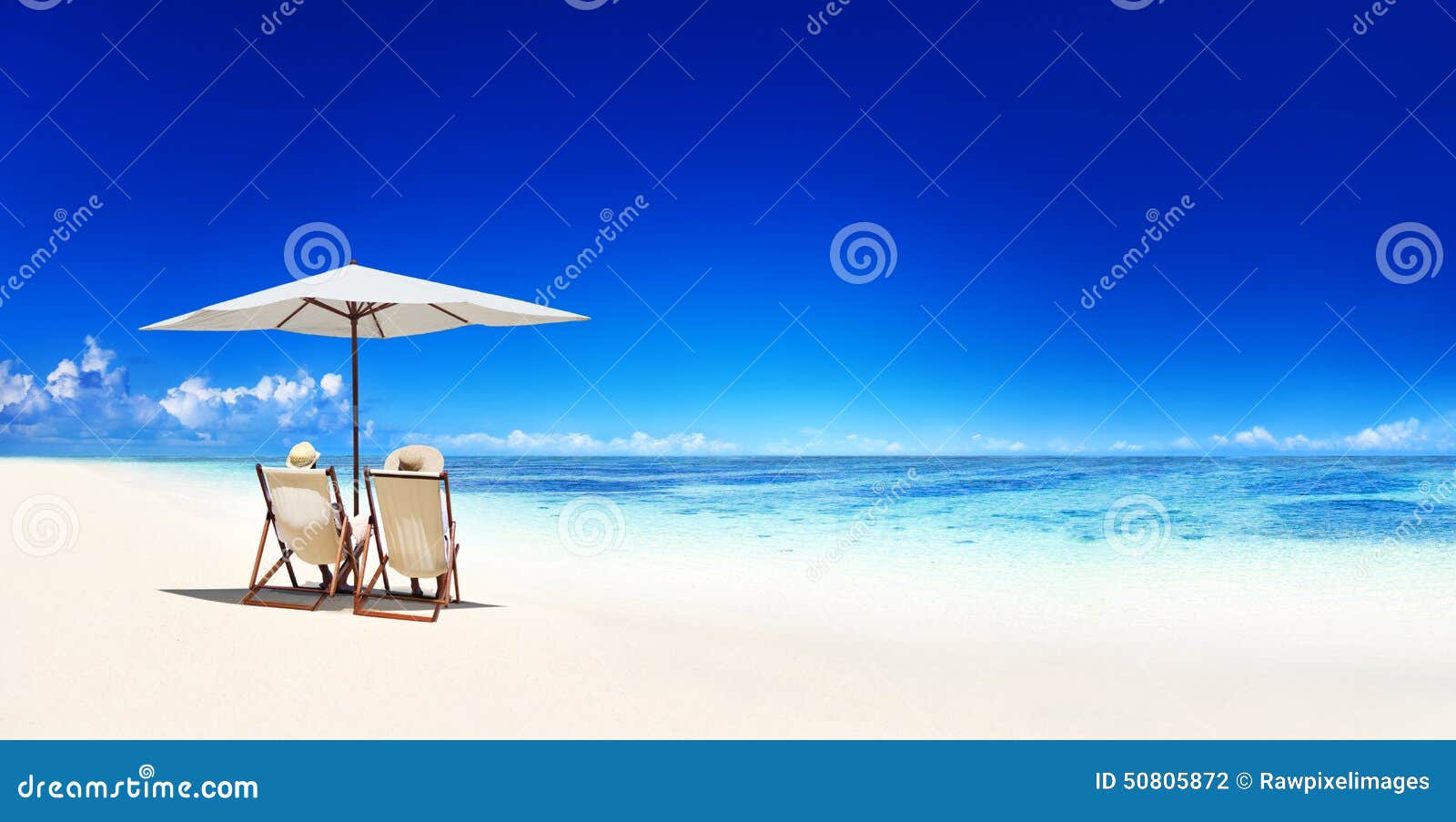 couple relaxing tropical beach vacation concept