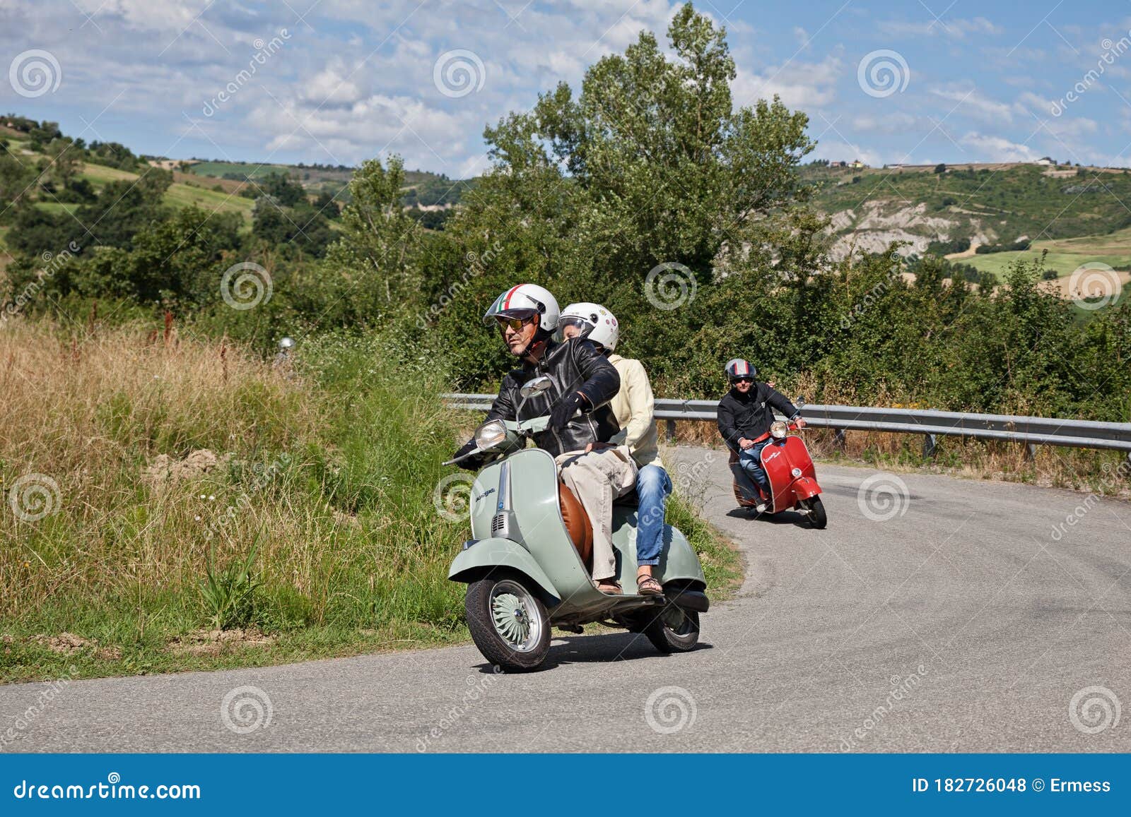 girl riding vespa scooter