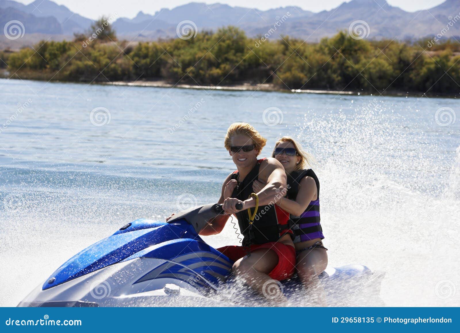 Couple Riding Water Scooter Stock Image Image of boating, horizontal