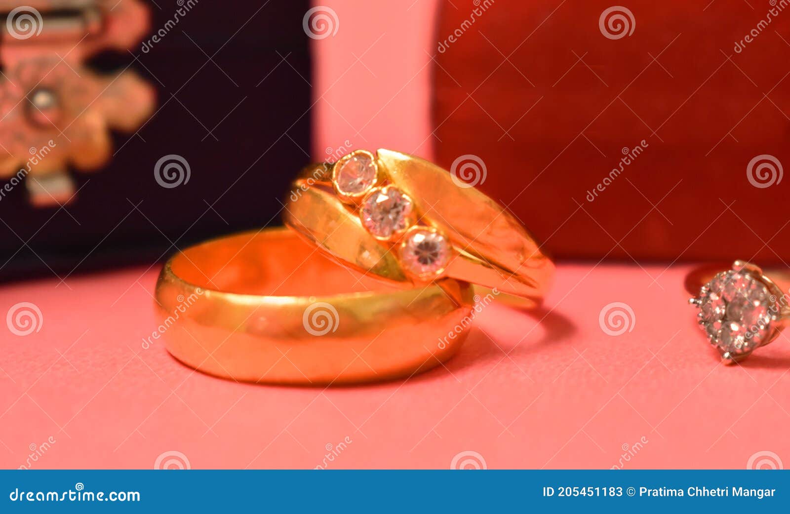 couple rings gold color relationship tradition red close up married wedding engagement love emotion table men women lifestyle no 205451183