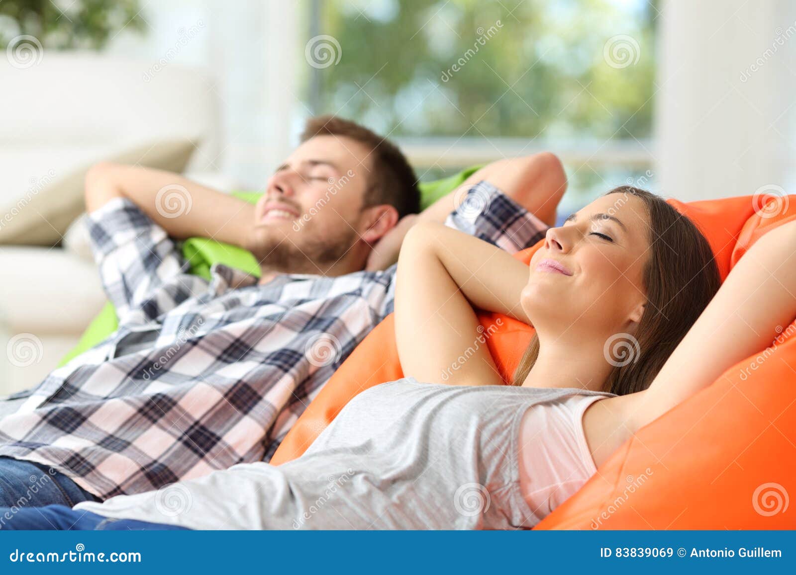 couple or roommates relaxing at home