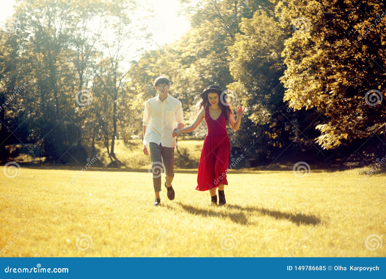 Couple Running In The Forest Field Girl In A Long Red Dress And Hat