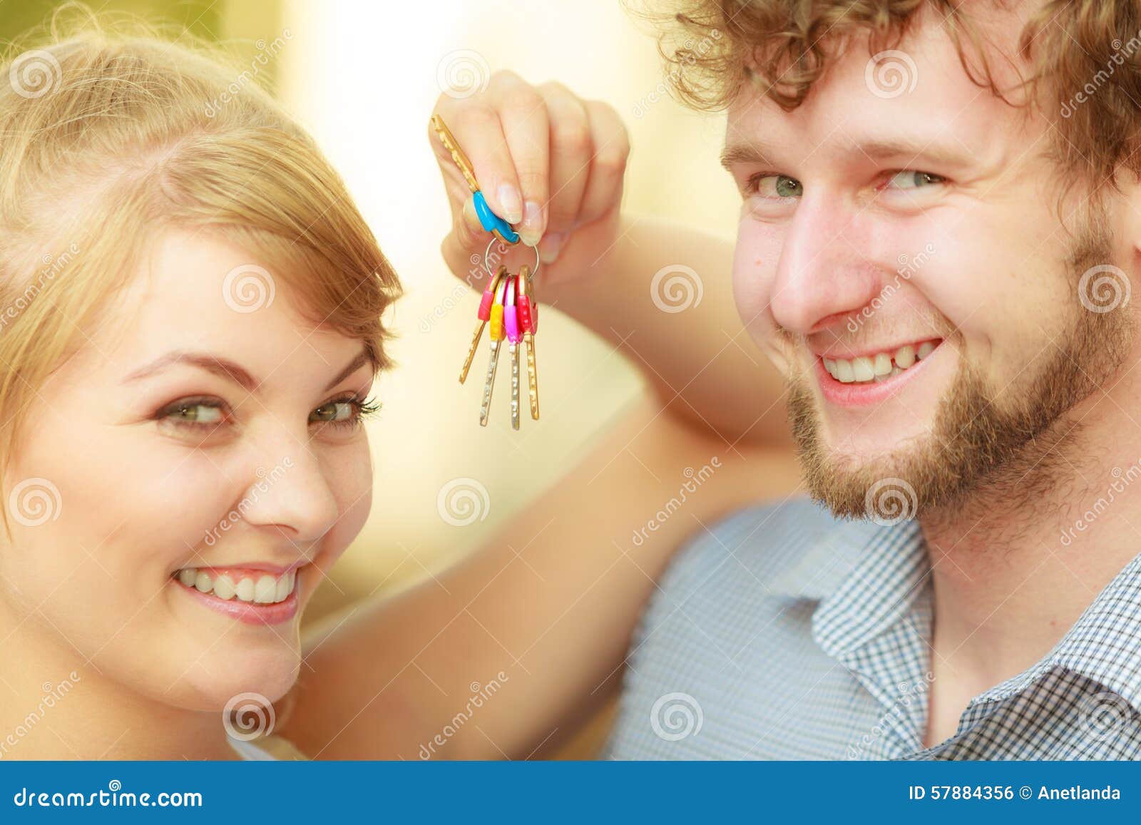 Couple Showing Their New House Keys Stock Photo - Image of holding