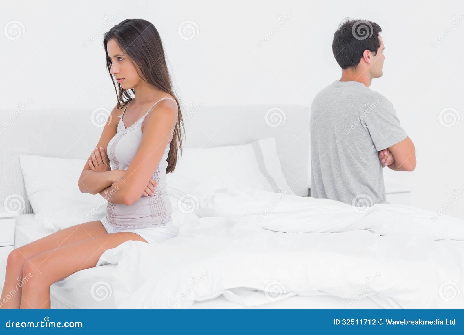 Couple Sitting on Their Opposite Sides on Bed Stock Photo Image of