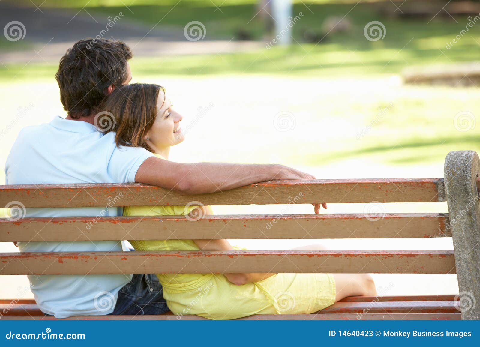 Couple Sitting Together On Park Bench Stock Image Image