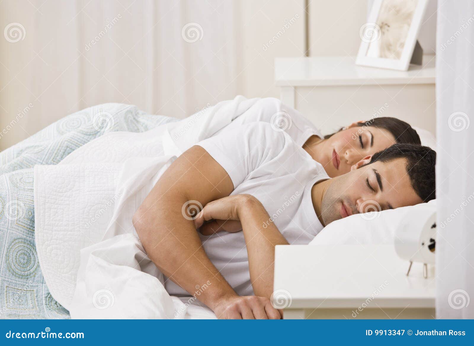 couple sleeping in bed