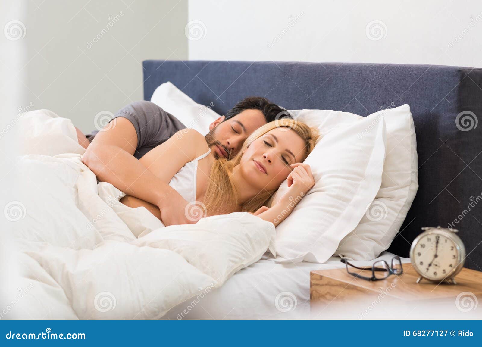 couple sleeping on bed