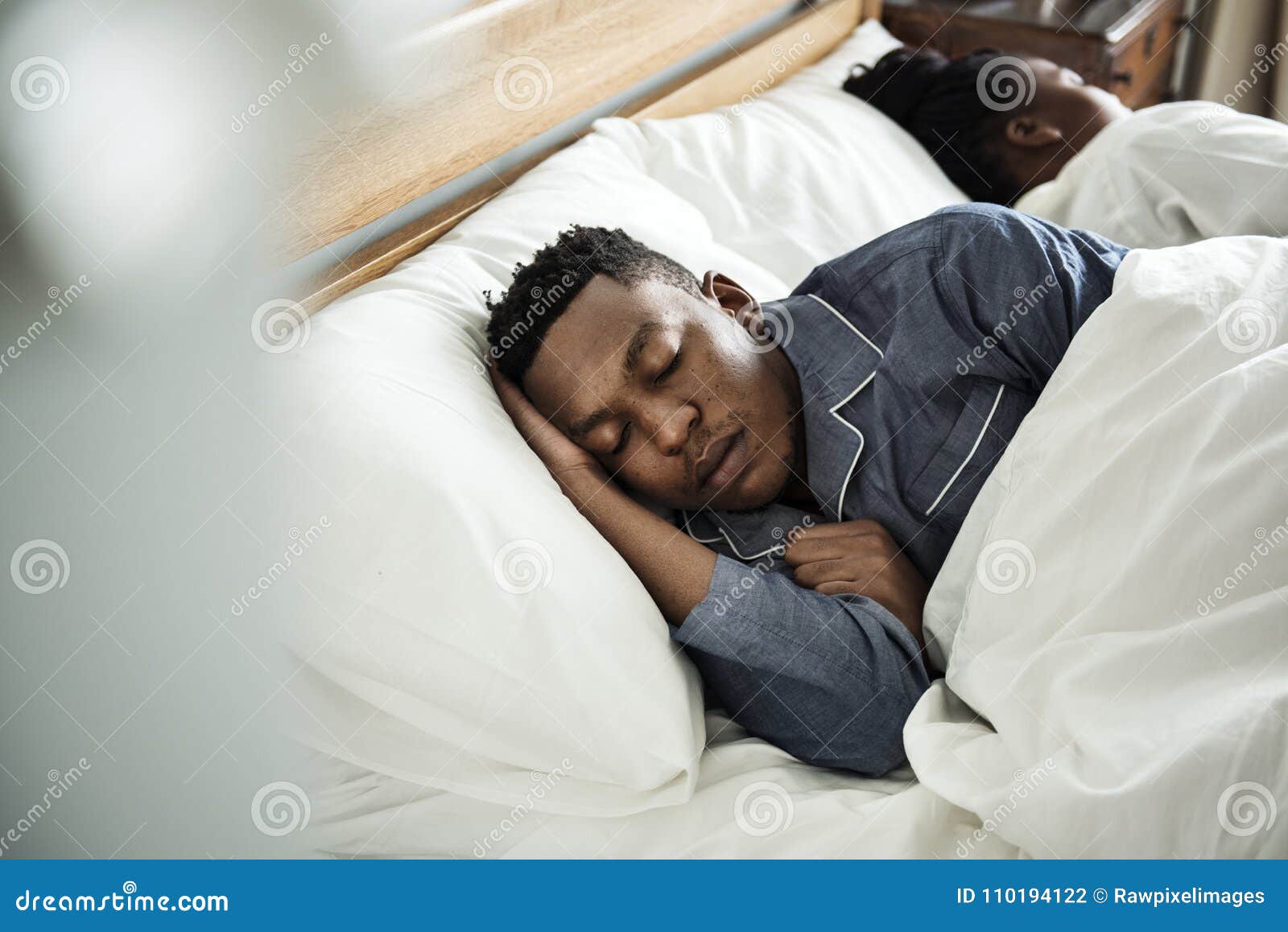 couple sleeping soundly in bed