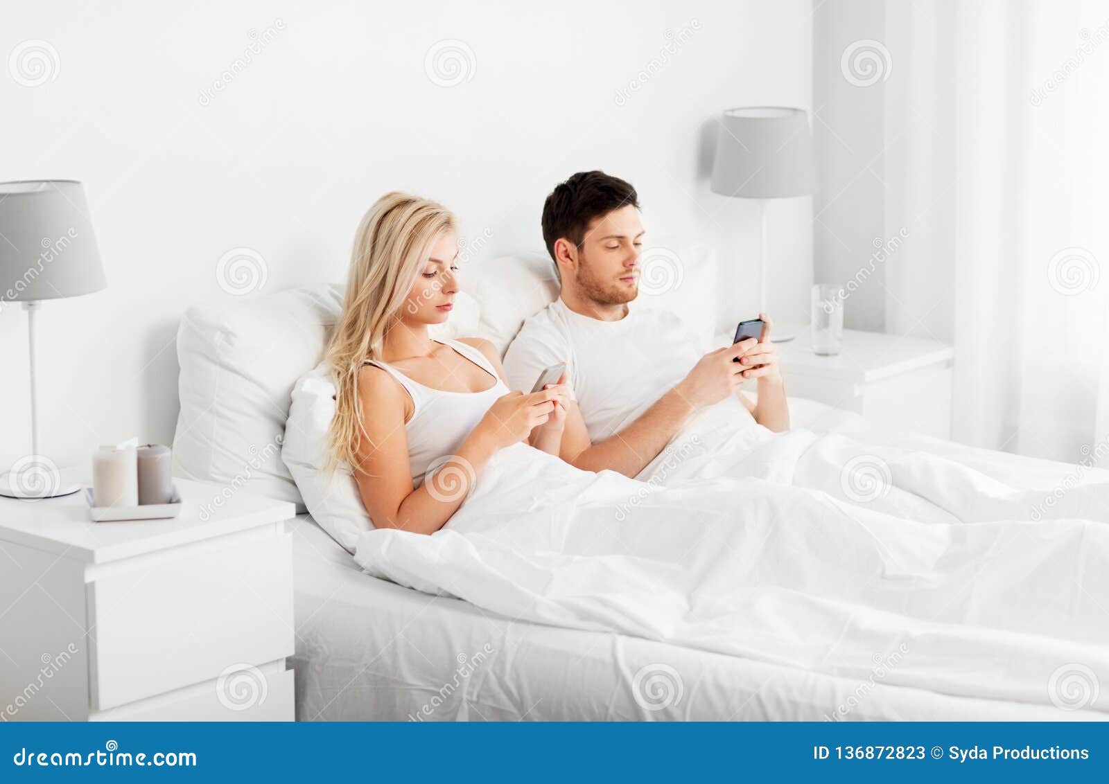 Couple With Smartphones In Bed Stock Image Image Of Adult Mobile