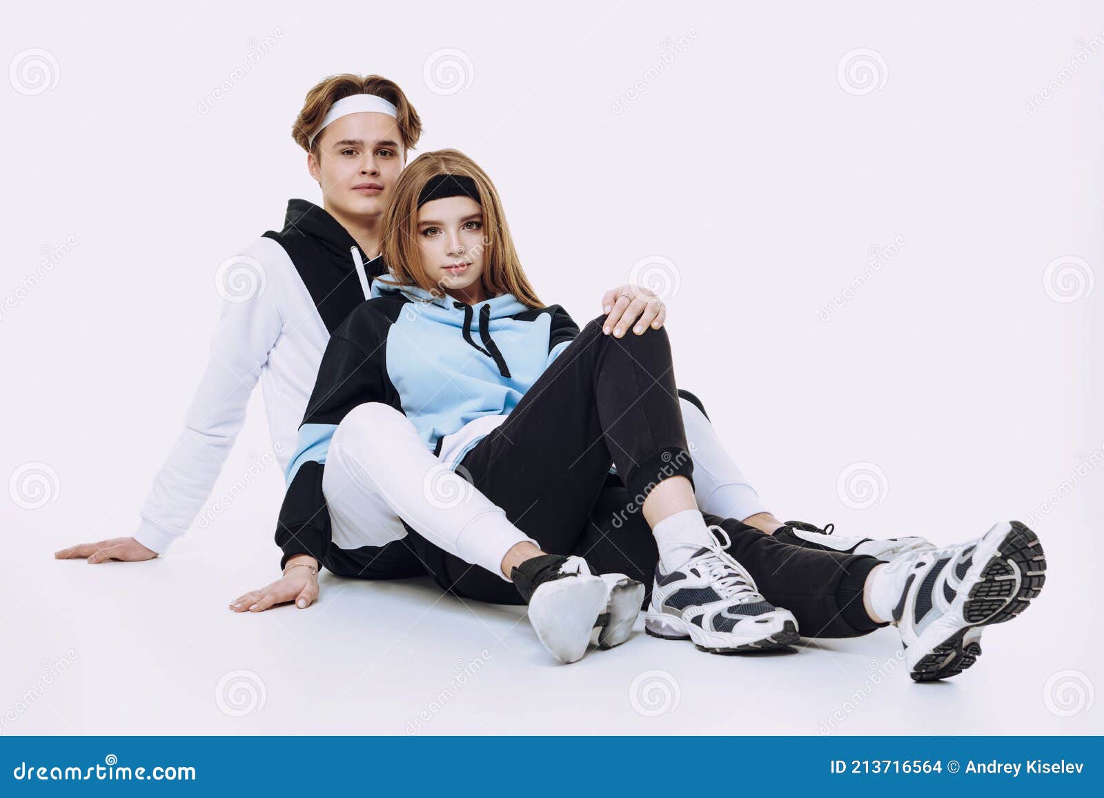 Couple Posing In Street Wear, Blue Backdrop, Free Stock Photo and Image  667827332